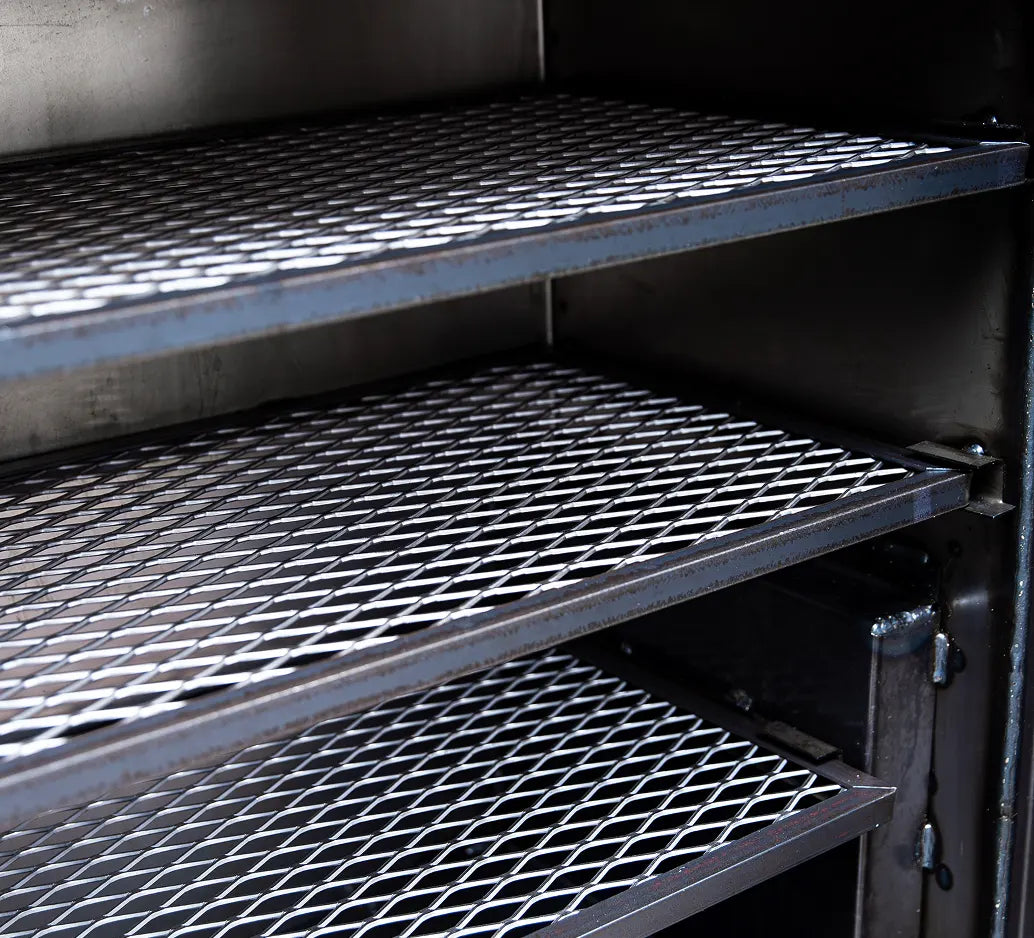 Cooking Grates of the Old Country BBQ Pits Insulated Gravity Fed BBQ Smoker.